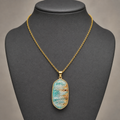 Amazonite geometric pendant on charcoal jewelry bust