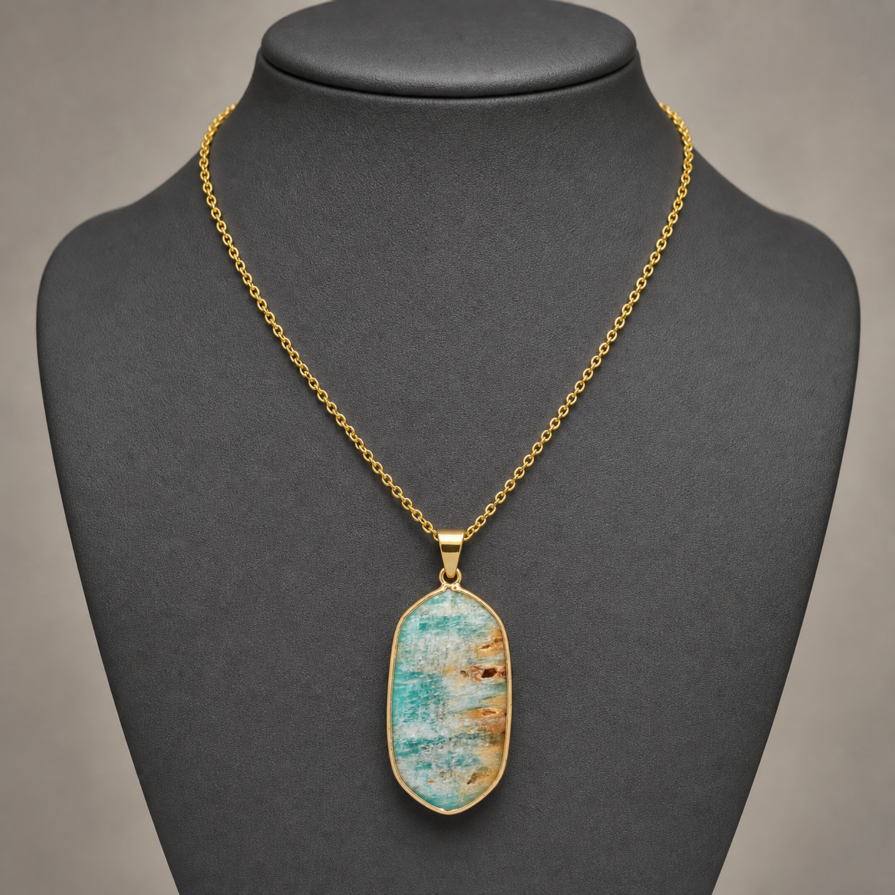 Amazonite geometric pendant on charcoal jewelry bust