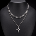 Silver double-layer Cuban star necklace on charcoal bust