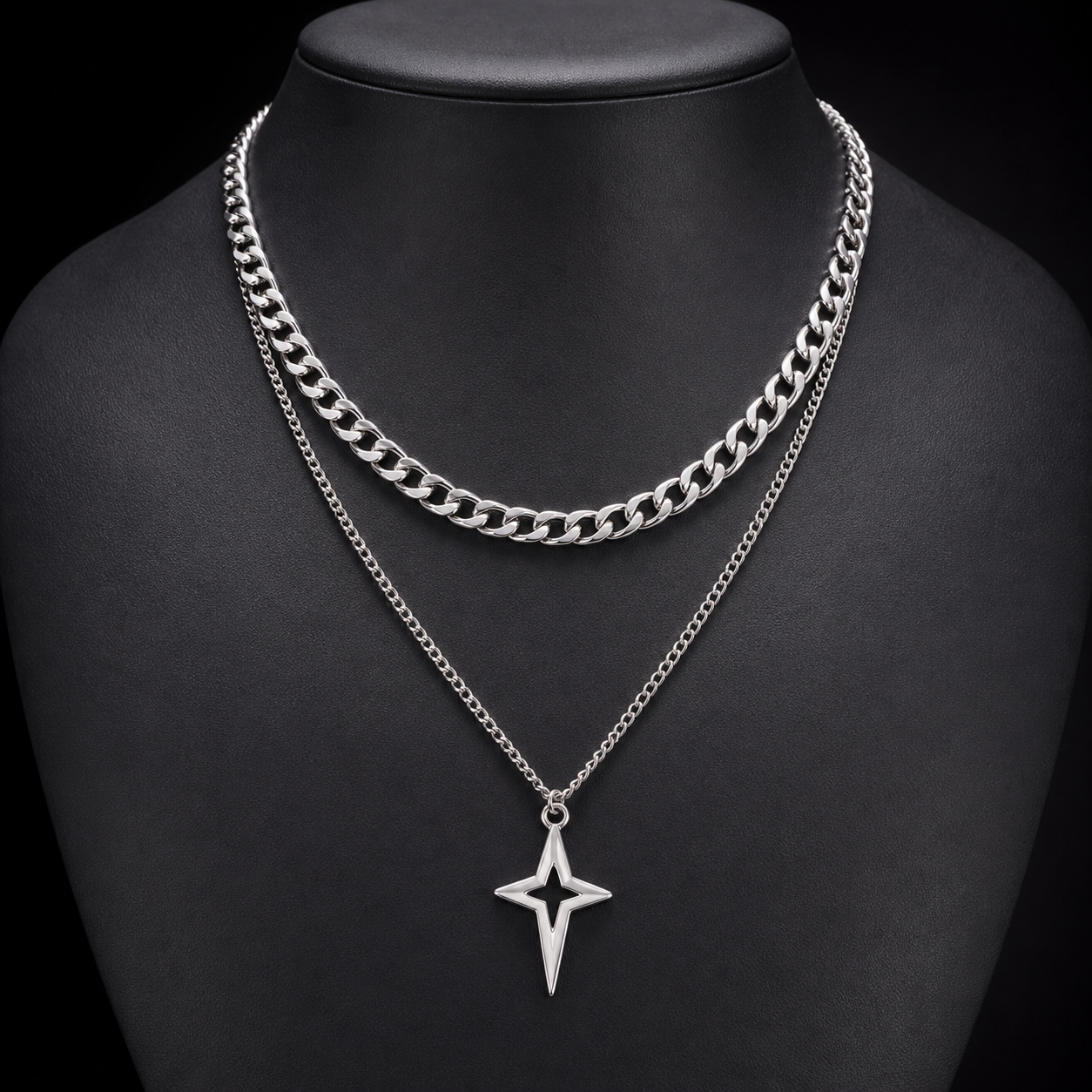 Silver double-layer Cuban star necklace on charcoal bust