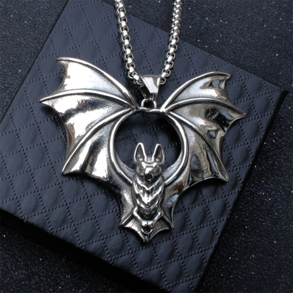 Original listing close-up showing the reflective silver flying bat pendant