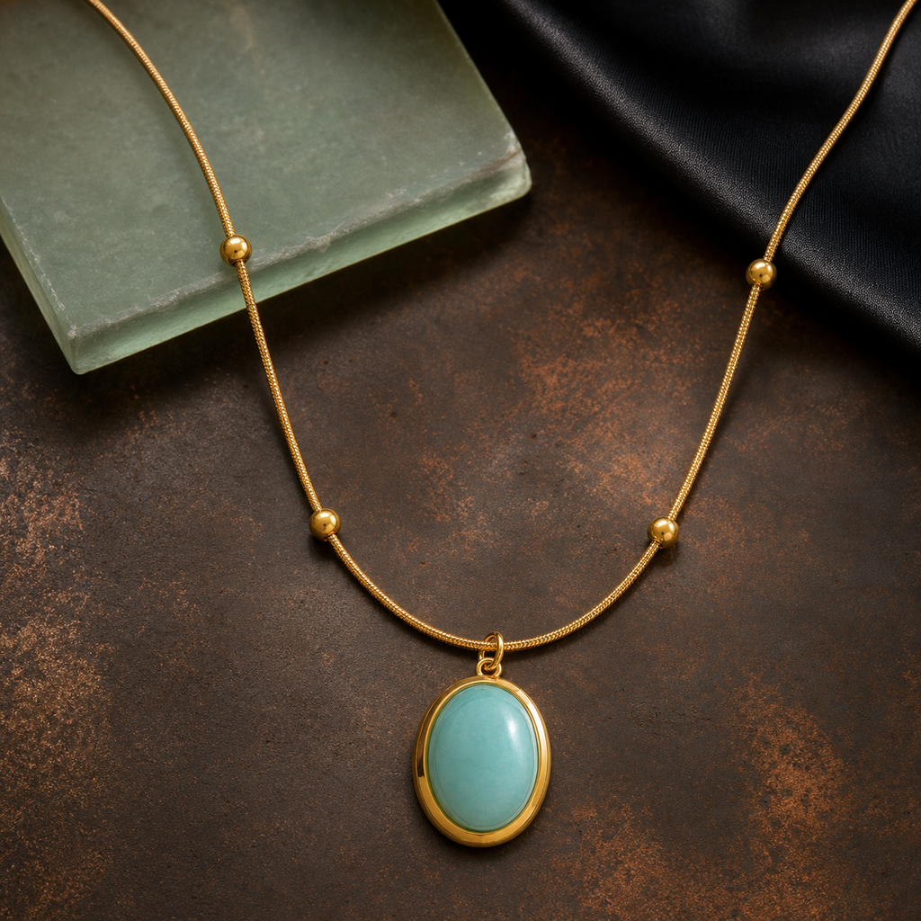 Green stone oval pendant necklace on oxidized copper