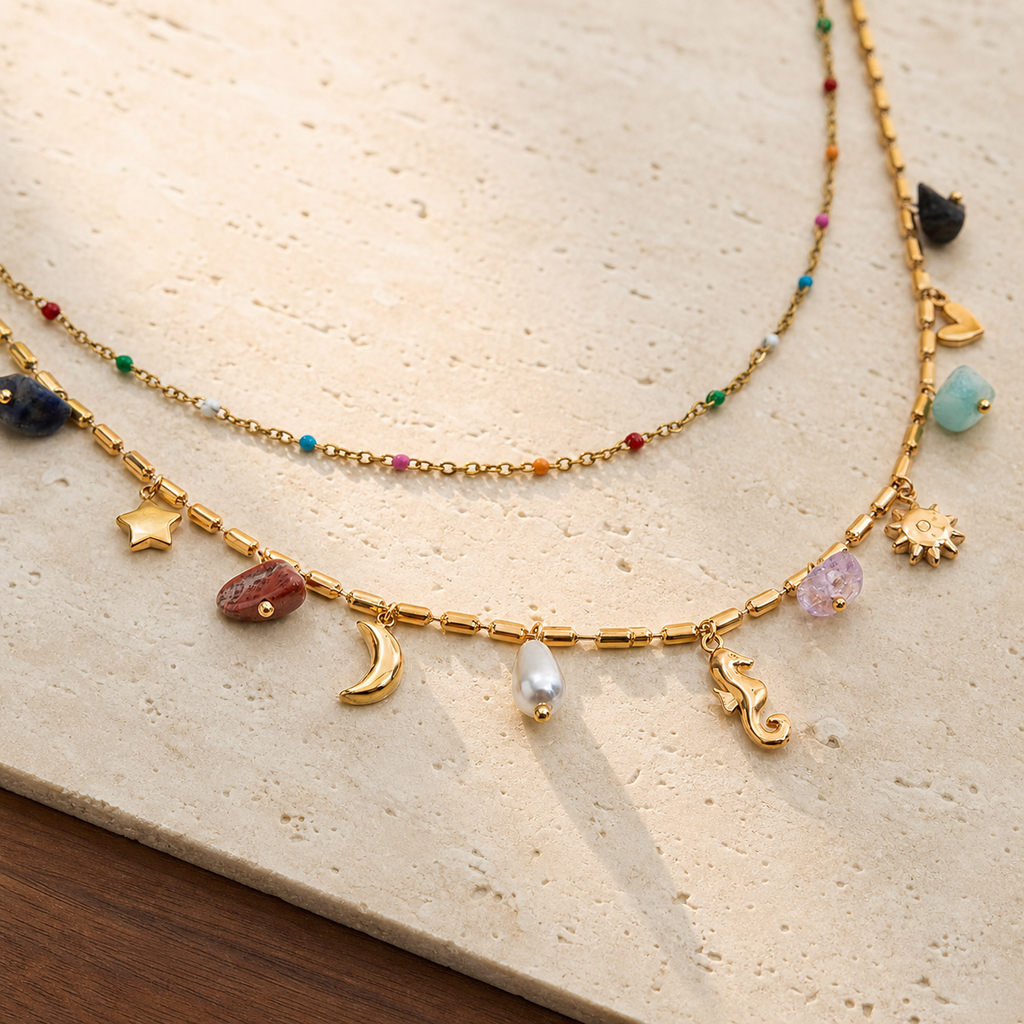 Natural-stone celestial layered necklace on travertine and walnut
