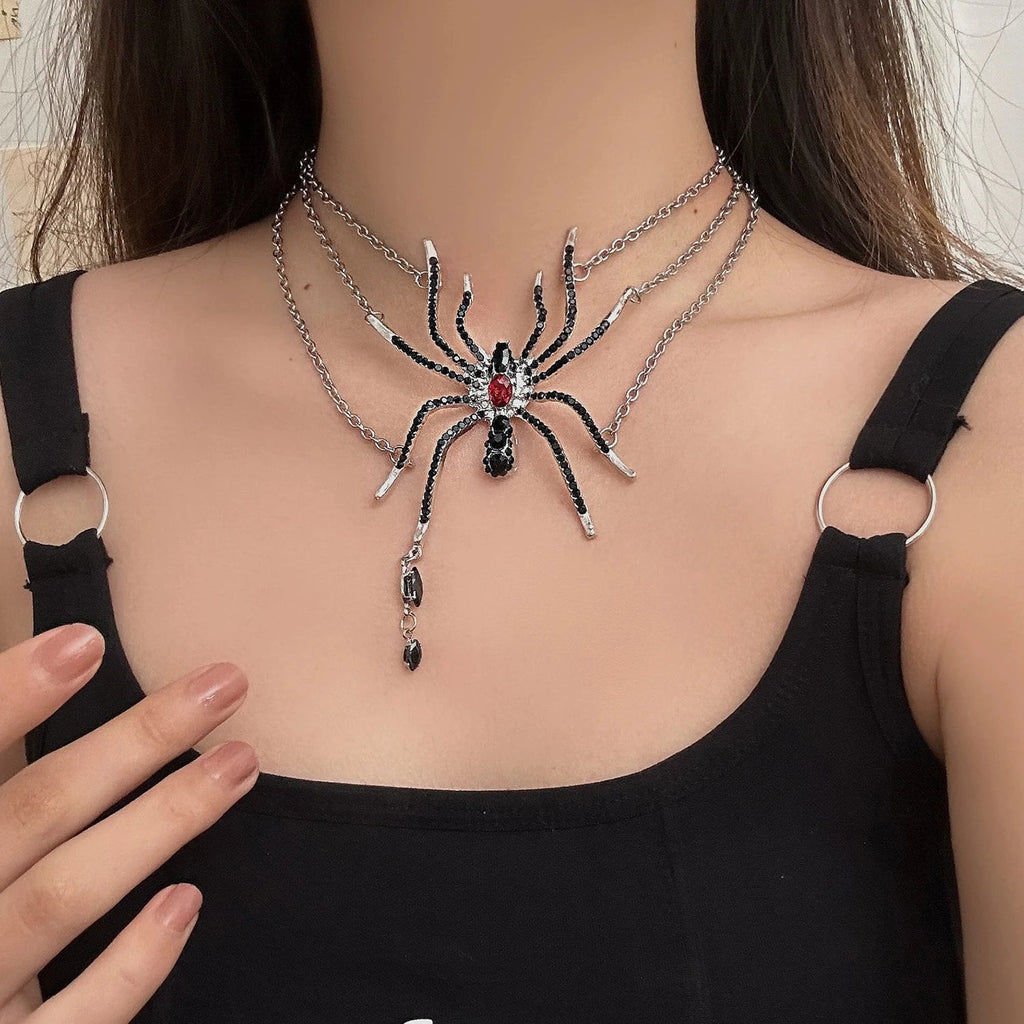 Layered gothic spider statement necklace worn on model