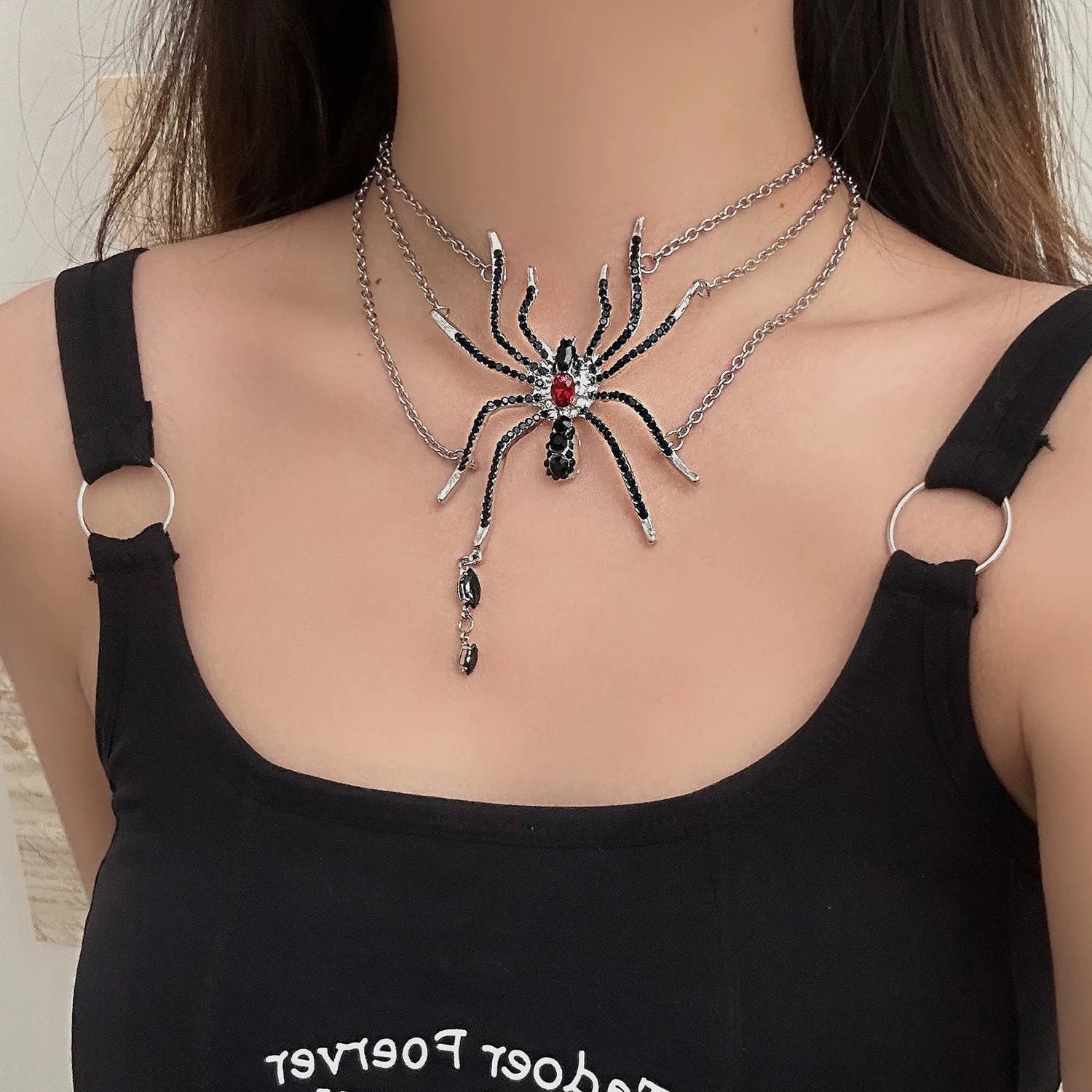Layered gothic spider necklace shown at its original on-model scale