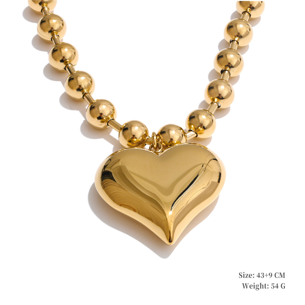 Original product view of polished gold heart and bead statement necklace