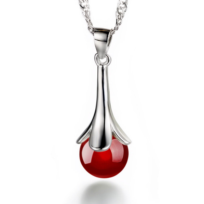 Original angled view of red agate drop pendant necklace