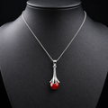 Red agate drop pendant necklace on charcoal bust