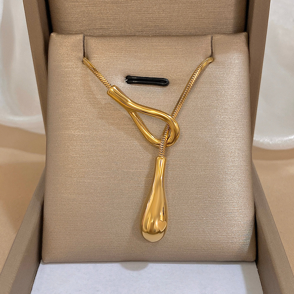 Original product image of the gold sculptural waterdrop necklace