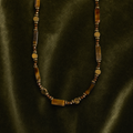 Tiger-eye beaded chain on olive velvet
